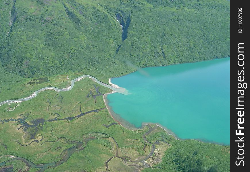 An aerial shot of glacial lake in the Alaska wilderness of Denali National park near Mt. McKinley. An aerial shot of glacial lake in the Alaska wilderness of Denali National park near Mt. McKinley