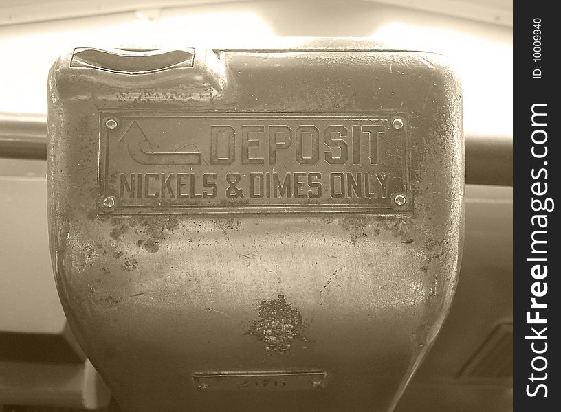 An old public bus fare box. An old public bus fare box.