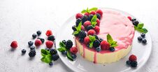 Cake With Butter And Fresh Berries And Fruits. Dessert. On A Wooden Background Stock Photos