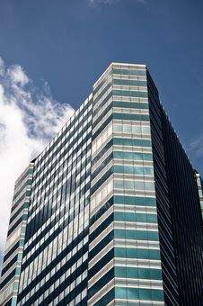 Glass Building With Blue Sky And White Clouds Royalty Free Stock Images