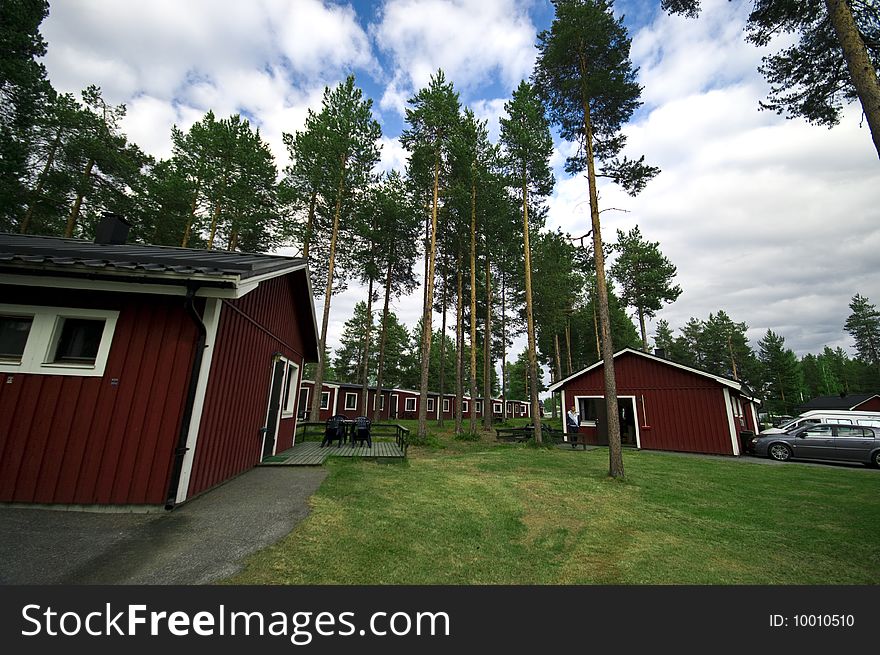 Red painted wooden huts at a Swedish camp site. Red painted wooden huts at a Swedish camp site.