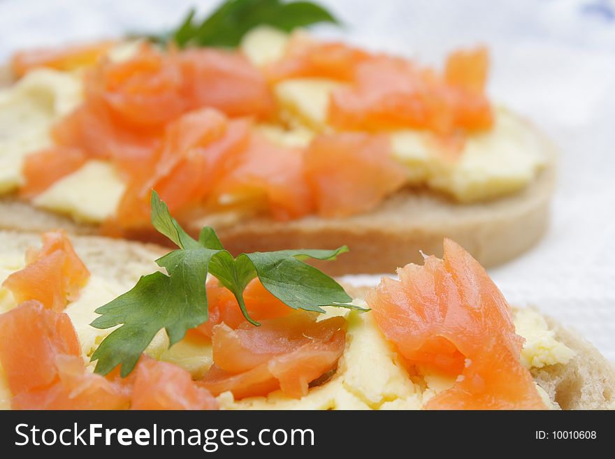 Sandwiches with a salmon, a butter and parsley. Sandwiches with a salmon, a butter and parsley.