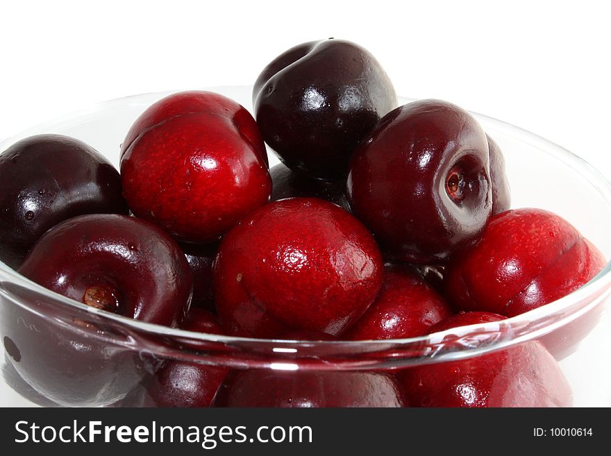 Sweet cherry on a white background, it is isolated. Sweet cherry on a white background, it is isolated