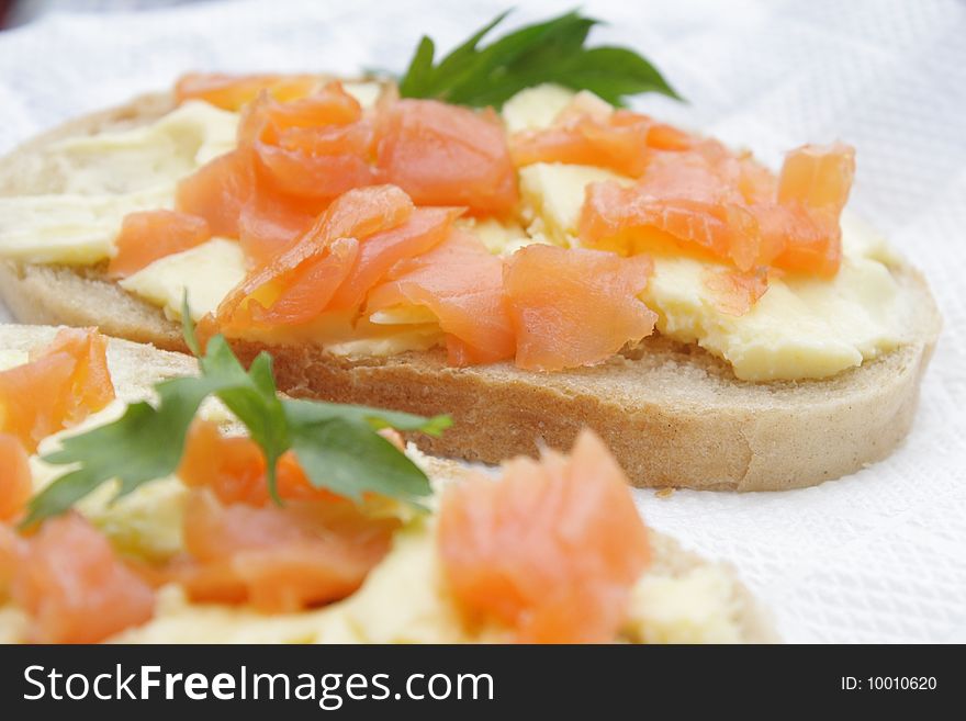 Sandwiches with a salmon, a butter and parsley. Sandwiches with a salmon, a butter and parsley.