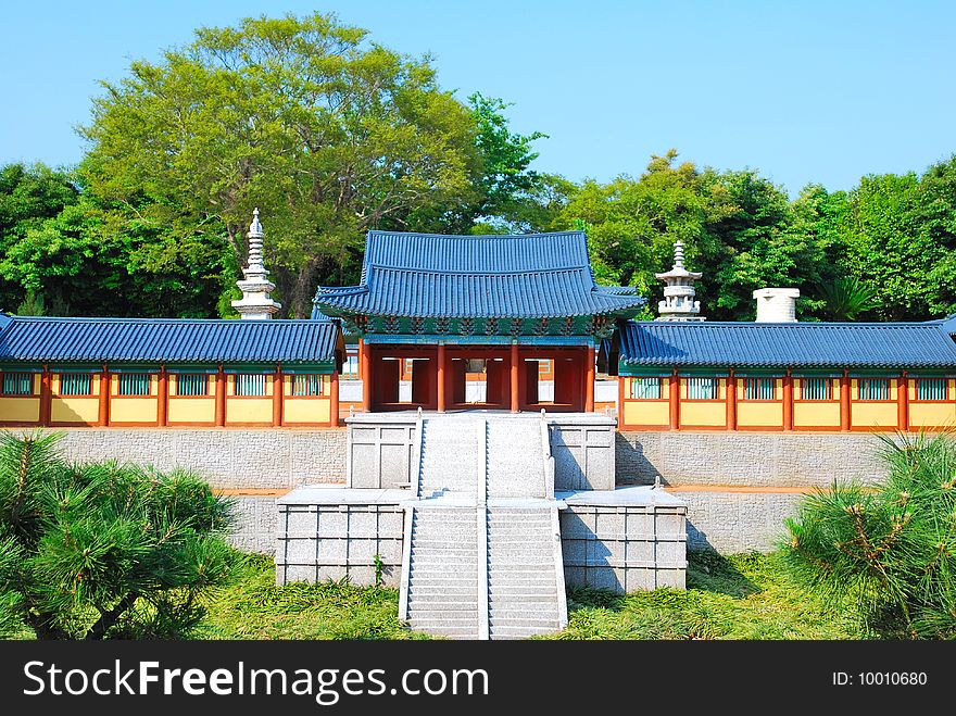 Front view of a model of temple architecture surrounded with nature. Front view of a model of temple architecture surrounded with nature