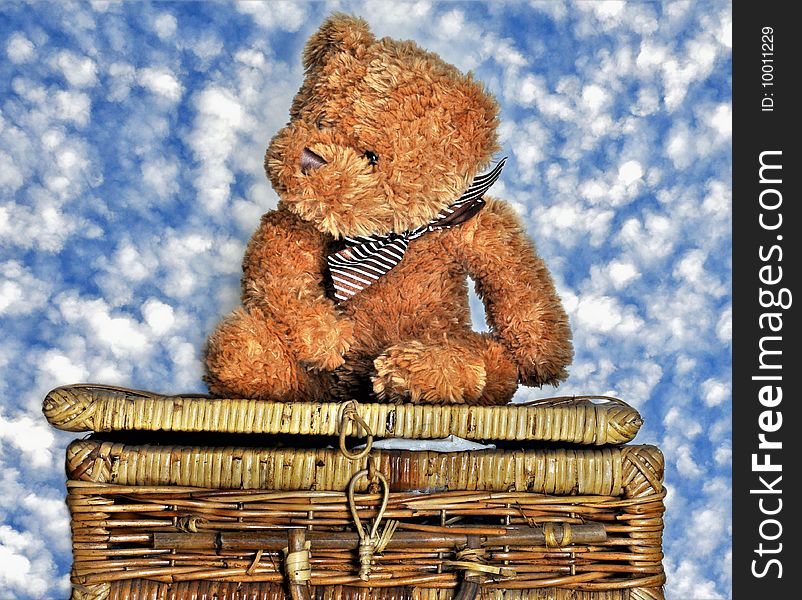 Teddy Bear sitting on picnic basket. Teddy Bear sitting on picnic basket