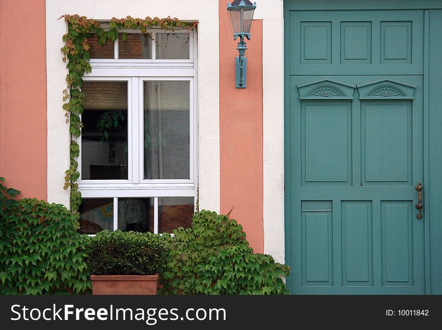 Typical cottage entrance in pastel colors. Typical cottage entrance in pastel colors