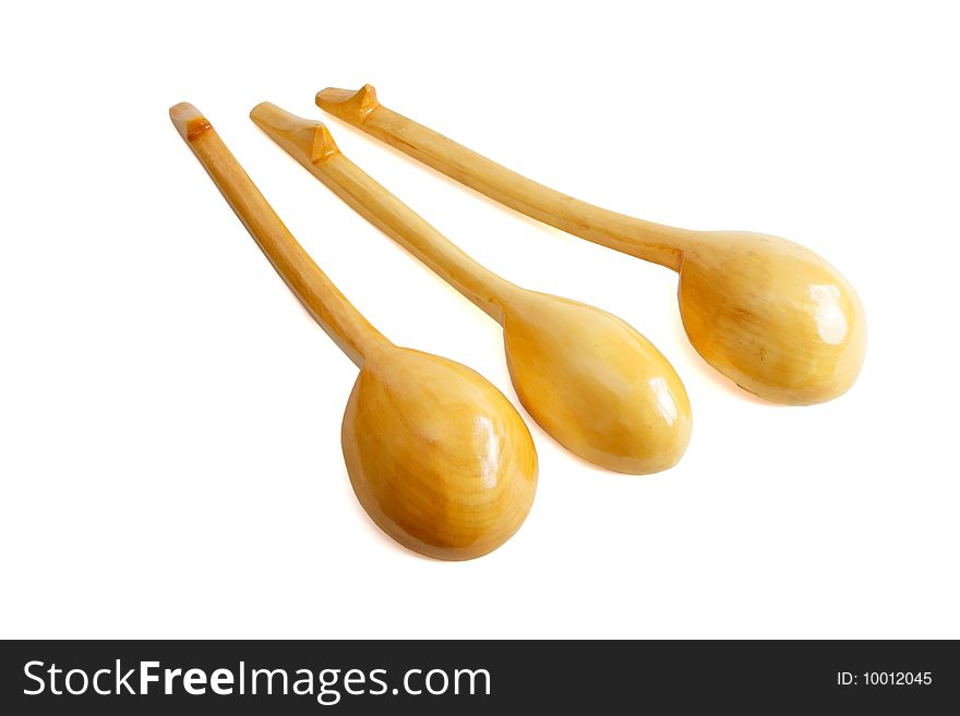 Three wooden spoons isolated on white background