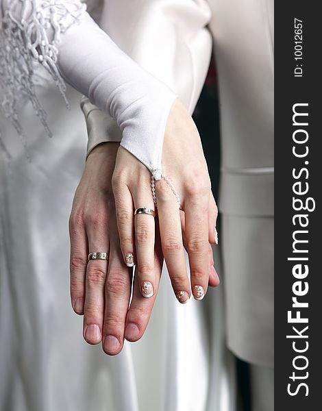 Hands with gold rings in wedding party. Hands with gold rings in wedding party