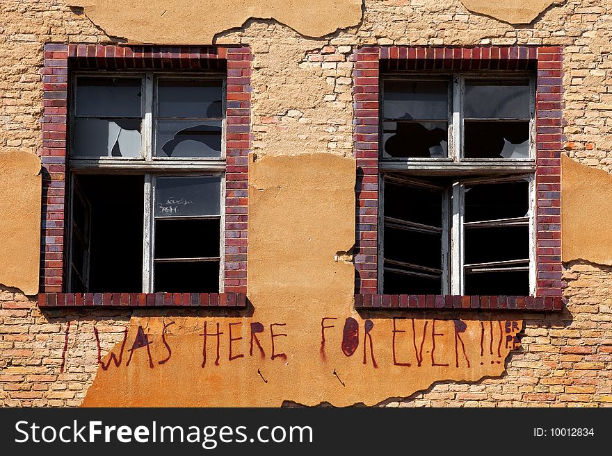 Old Brick Wall with Broken glass on the window