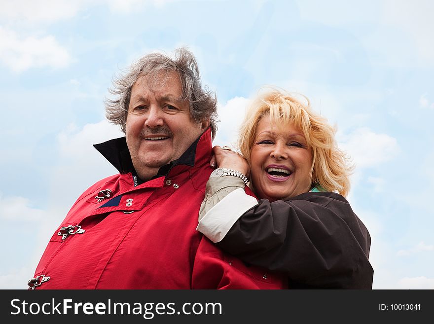 Senior woman hugging her husband isolated on white. Senior woman hugging her husband isolated on white