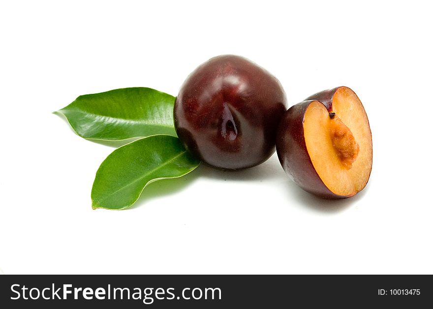 Plum and section isolated on white background