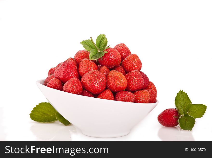 Strawberry in the bowl on white background