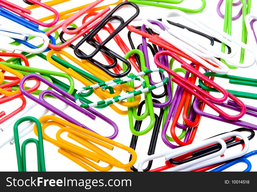 Color Paper Clips To Background. Isolated On White