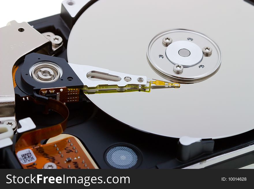 Close-up inside view of  hard disk isolated on white background