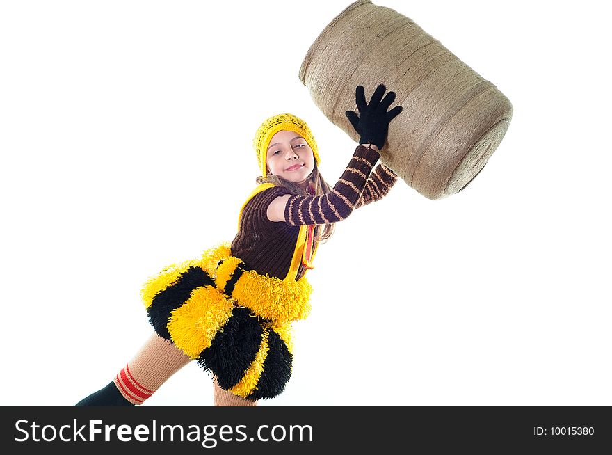 The joyful girl in a knitted suit holds to a flank