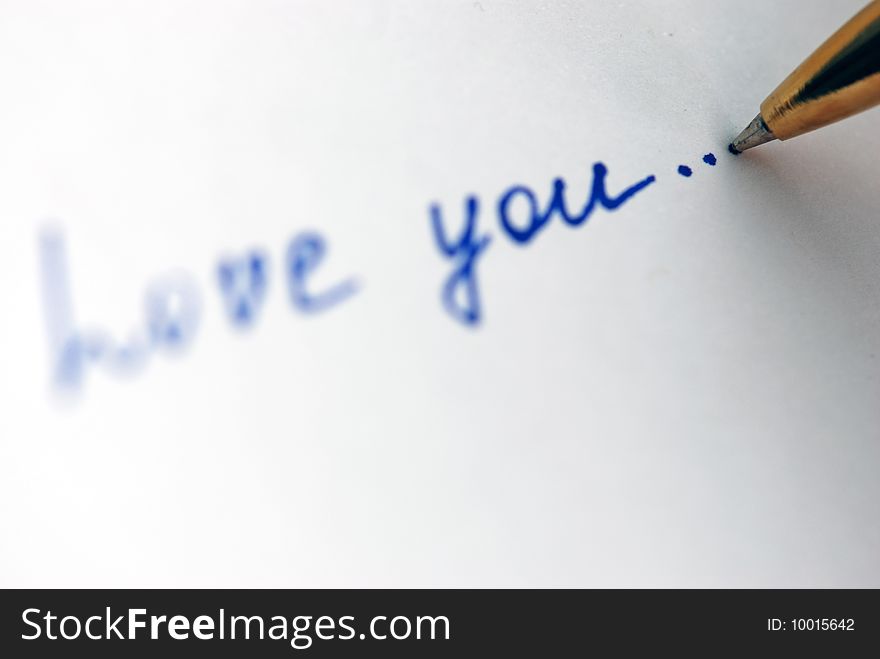 Pen writing  Love you on the paper. Pen writing  Love you on the paper