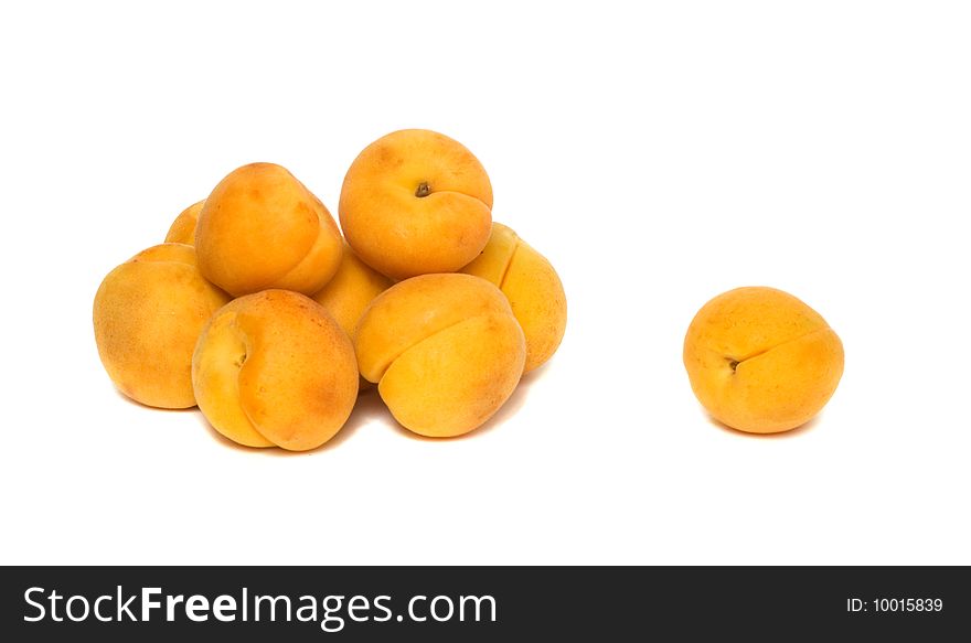 Pile o apricots isolated on white background