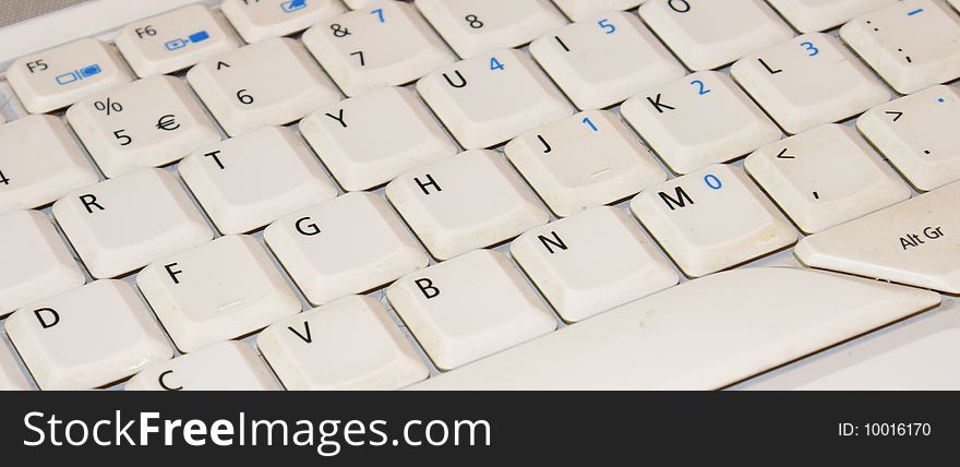 A laptop keyboard with QWERTY key pad. A laptop keyboard with QWERTY key pad.