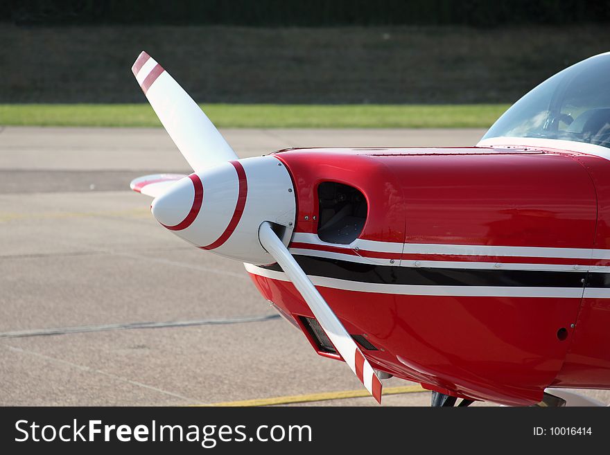 Propeller of a red small Sportsplane. Propeller of a red small Sportsplane