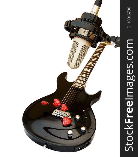 Song of Love - black electric guitar with recording studio microphone and red hearts. Isolated on white. Song of Love - black electric guitar with recording studio microphone and red hearts. Isolated on white.