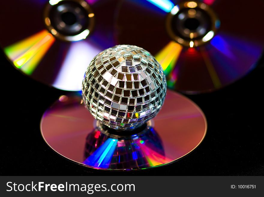 Disco ball with music DVDS on black