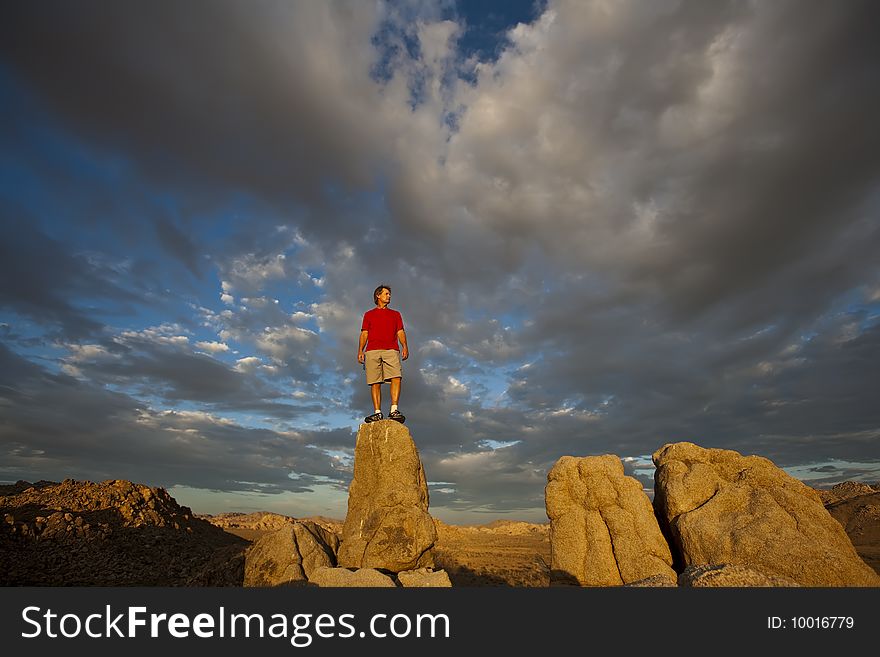 Rock Climber On The Summit.