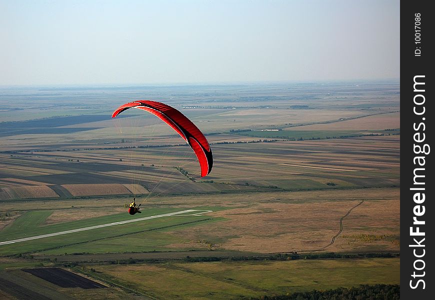 Paraglider flying in the sky