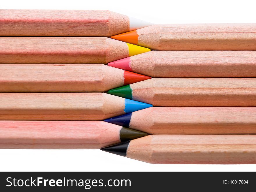 Colorful pencils in a row isolated on white