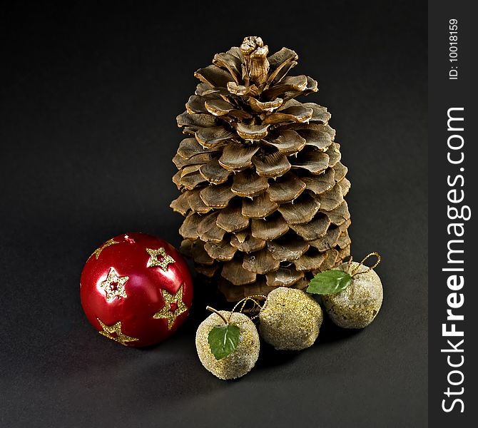 Decorative Christmas ball,cone and three small paradise apples. Decorative Christmas ball,cone and three small paradise apples