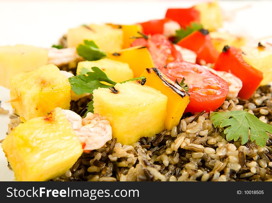 Shrimp on Bamboo skewers served on a bed of wild rice. Shrimp on Bamboo skewers served on a bed of wild rice