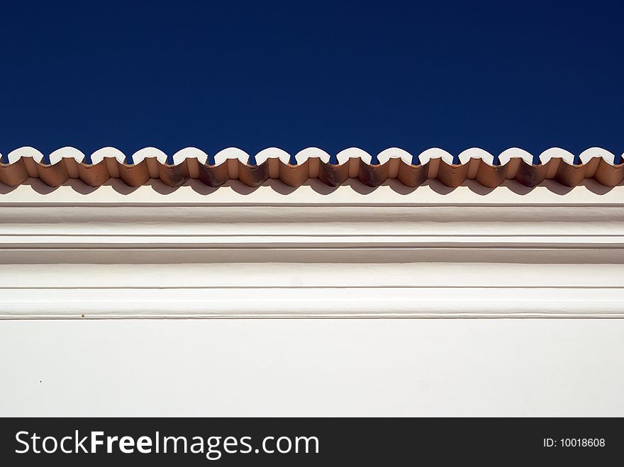 A traditional roofline of a house in Algarve. A traditional roofline of a house in Algarve