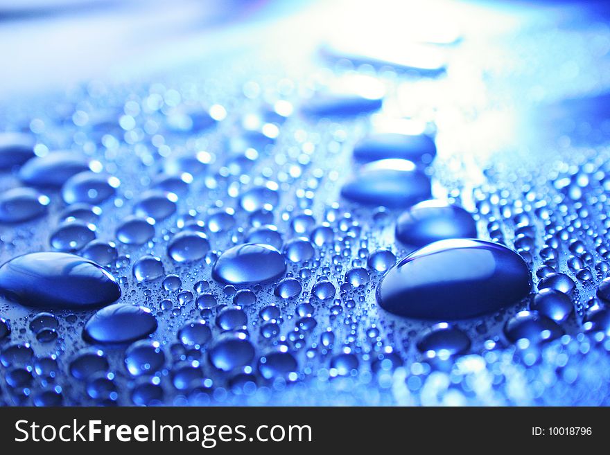 Drops on a dark blue surface. Drops on a dark blue surface