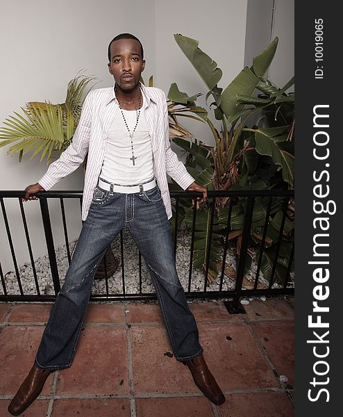 Handsome male leaning on a rail