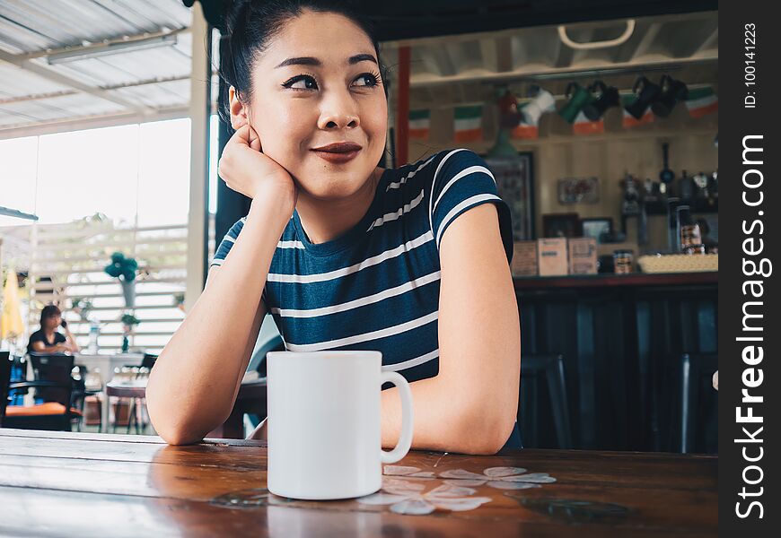 Happy Woman Drinking Coffee In Coffee Cafe.