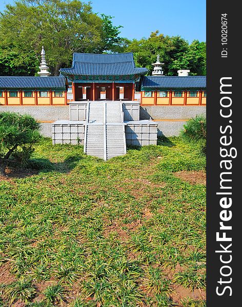 Front view of temple architecture surrounded with nature