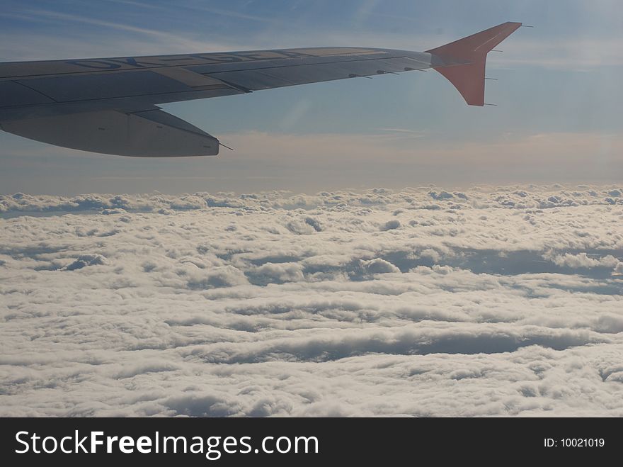 View From Plane on Clouds And Wing Of Plane. View From Plane on Clouds And Wing Of Plane