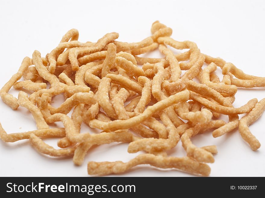 Isolated macro image of dried Chinese noodles ready to be cooked.