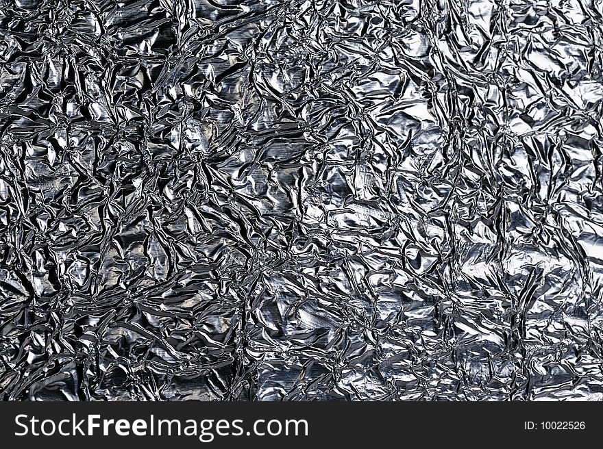 Texture of crumpled foil paper close up