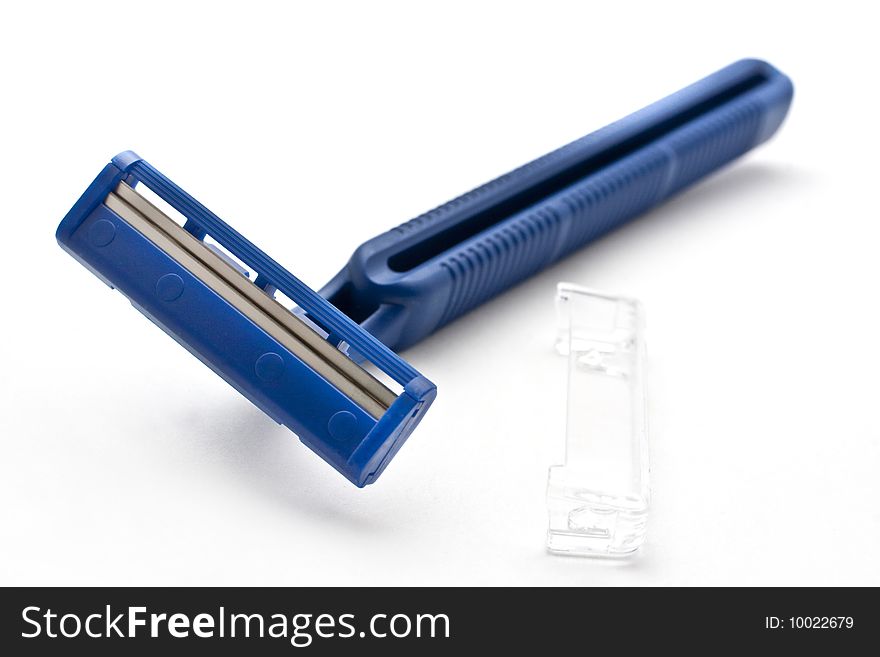 A disposable shaver against white background. A disposable shaver against white background