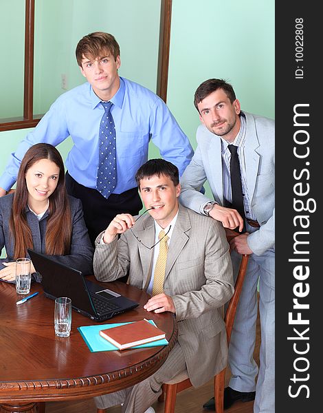 Business theme: business people in a work process in office. Business theme: business people in a work process in office.