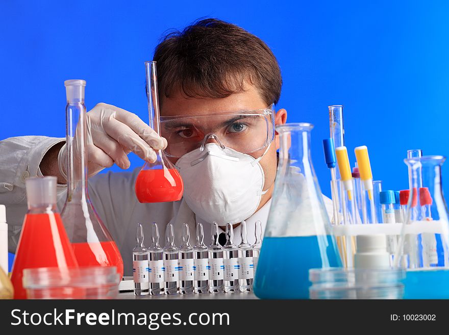 Medical theme: serious doctor working in a laboratory.