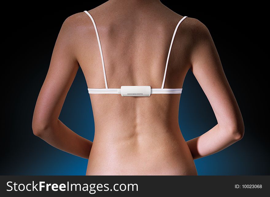 Back of woman with technological white brassiere and electronic device with path. Back of woman with technological white brassiere and electronic device with path