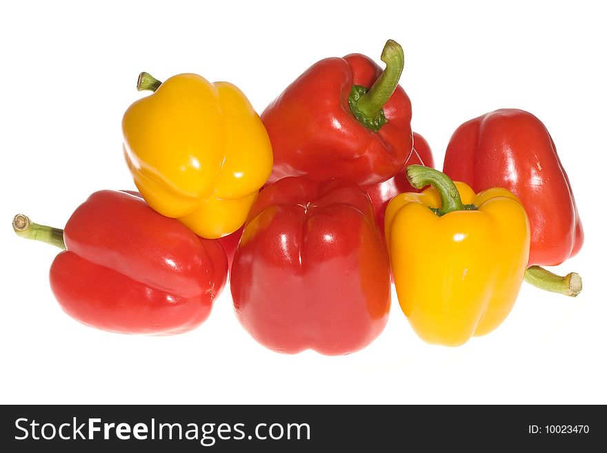 Red and yellow peppers on white background