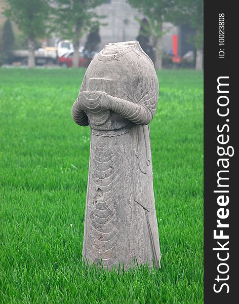 Decapitated stone sculpture at Songling, tombs of the Song Dynasty in Gongyi, Henan, China. Decapitated stone sculpture at Songling, tombs of the Song Dynasty in Gongyi, Henan, China.