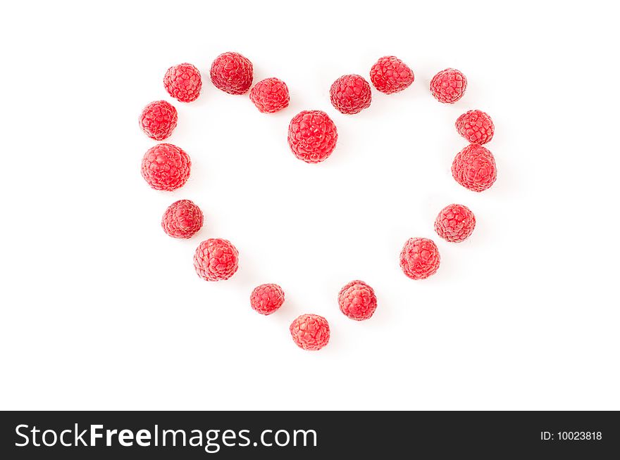 Heart made from raspberries on white background. Heart made from raspberries on white background