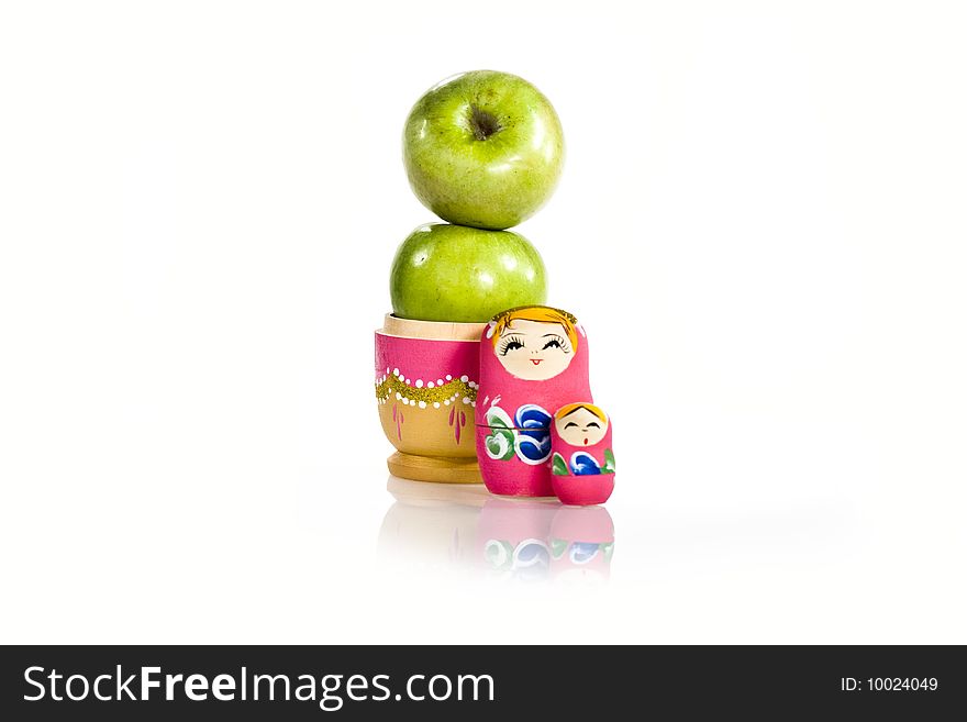 Composition from two green apples and the opened Russian nested doll. Composition from two green apples and the opened Russian nested doll