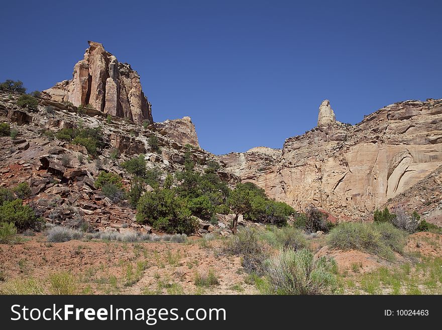 View of red rock formations in San Rafael Swell with blue skyï¿½s