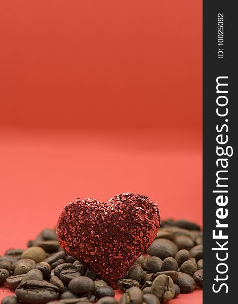 Coffee with red heart on a background