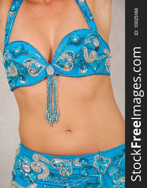 Belly-dancer in traditional turquoise blue attire. Belly-dancer in traditional turquoise blue attire